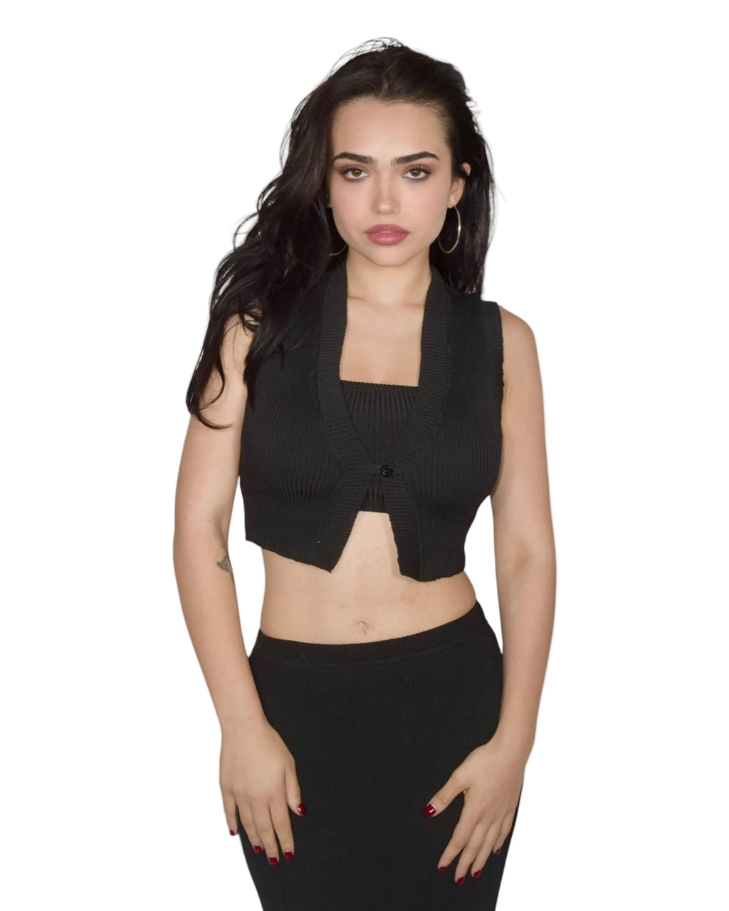 Woman wearing a black sleeveless top and skirt on a white background