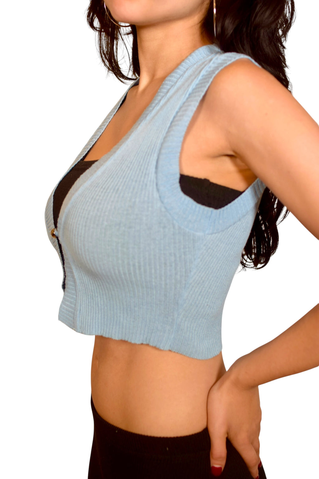 Light blue ribbed crop top worn by a person on a white background