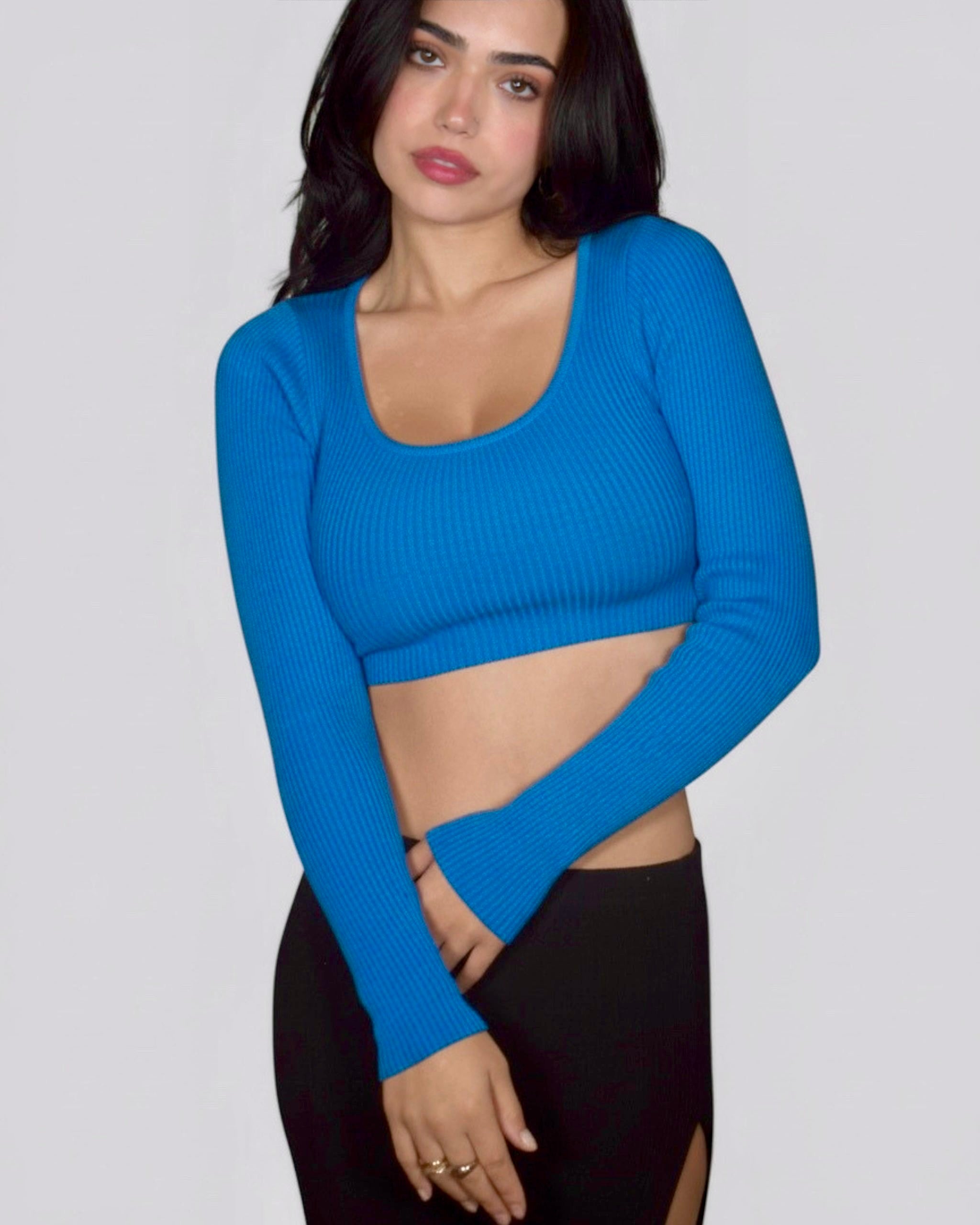Woman wearing long sleeve cobalt top by The Knit House LA