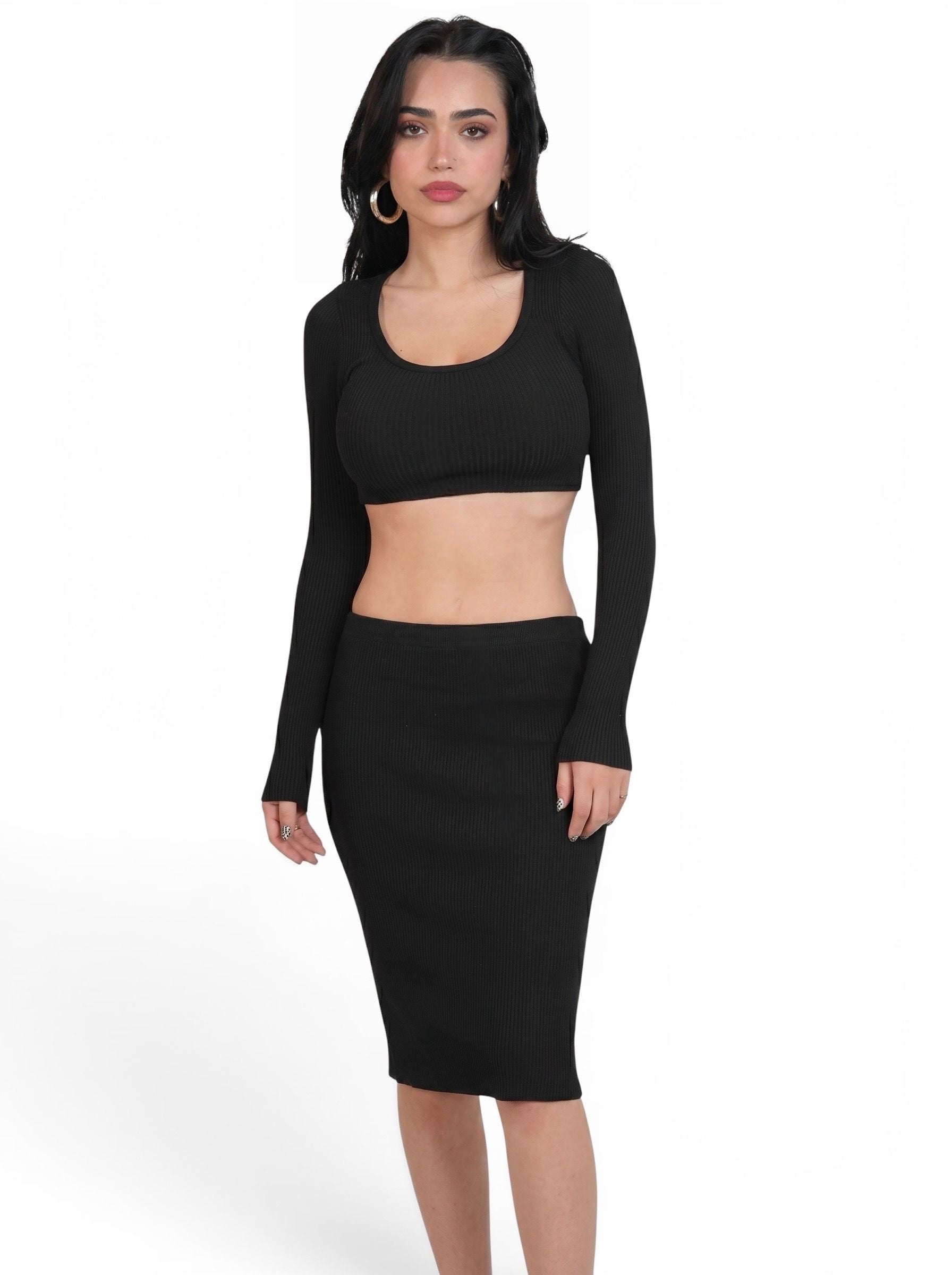 Woman wearing matching black rib knit crop long sleeve scoop neck top and pencil skirt by TKHLA 