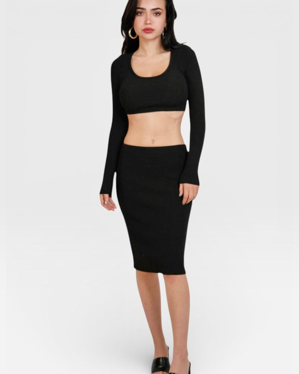 Woman wearing black rib knit scoop neck long sleeve top and midi skirt by The Knit House LA