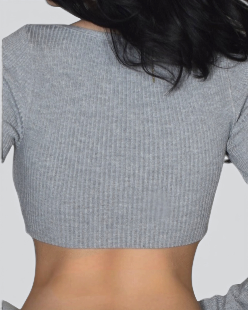 Mist Gray textured crop top worn by a person on a plain background