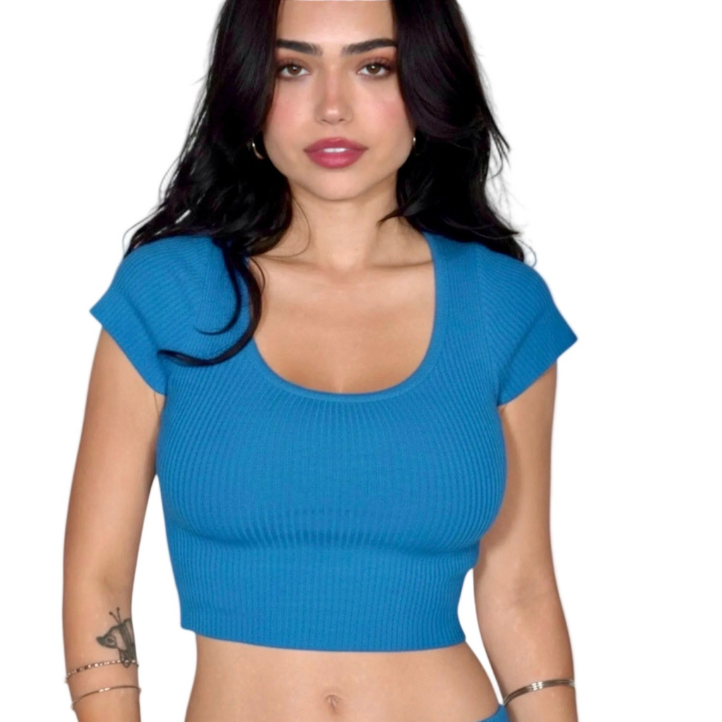 woman wearing a cobalt blue crop short sleeve rib knit top with scoop neck, by The Knit House LA