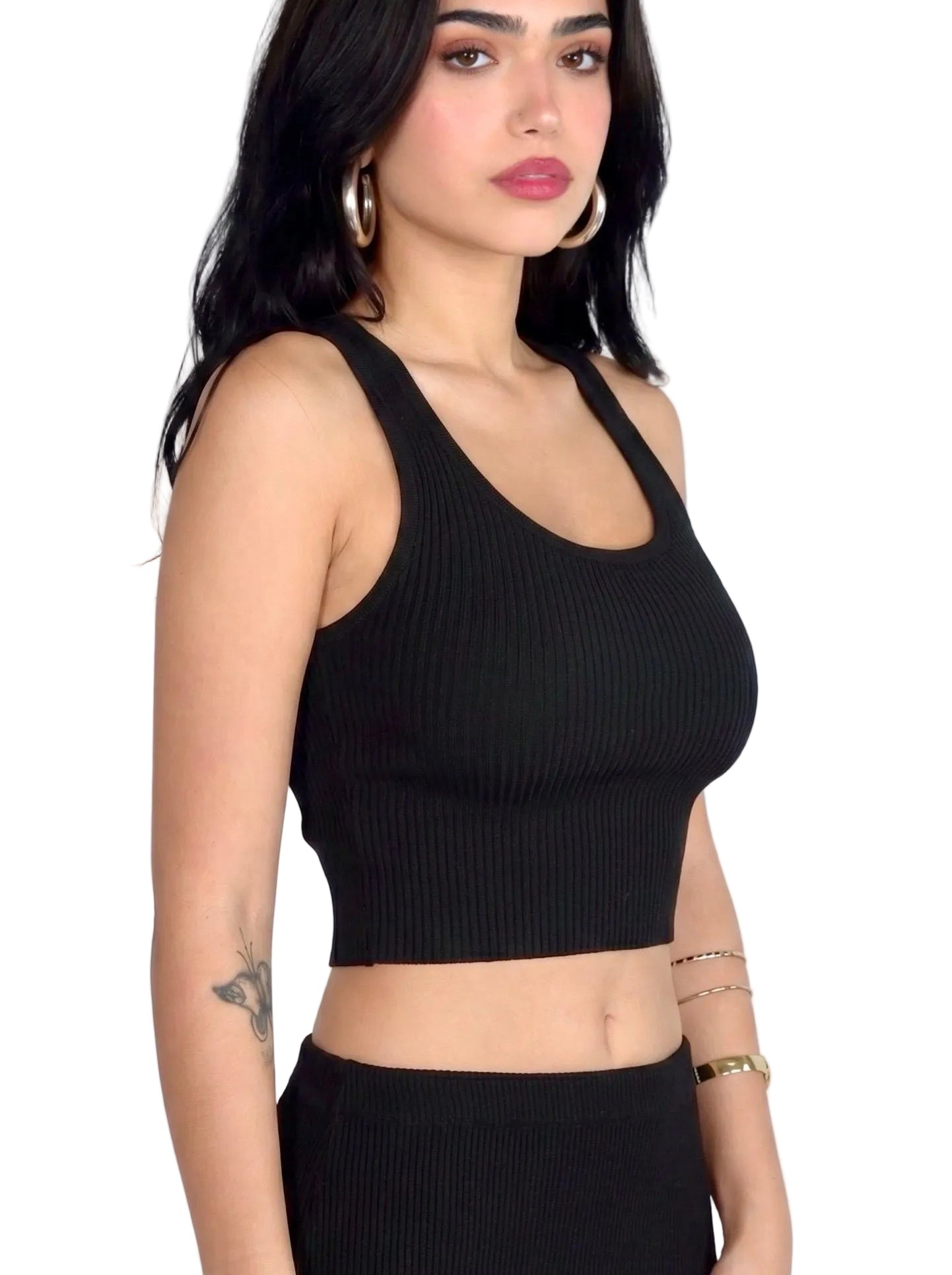 Woman wearing matching black rib knit crop scoop neck tank and pencil skirt by TKHLA 