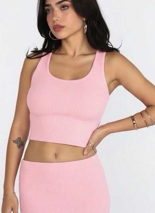 Woman wearing a pink outfit with a white background