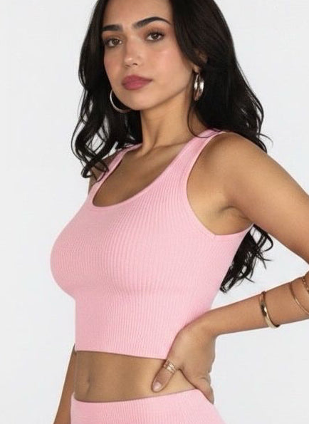 Woman wearing a pink outfit with a white background