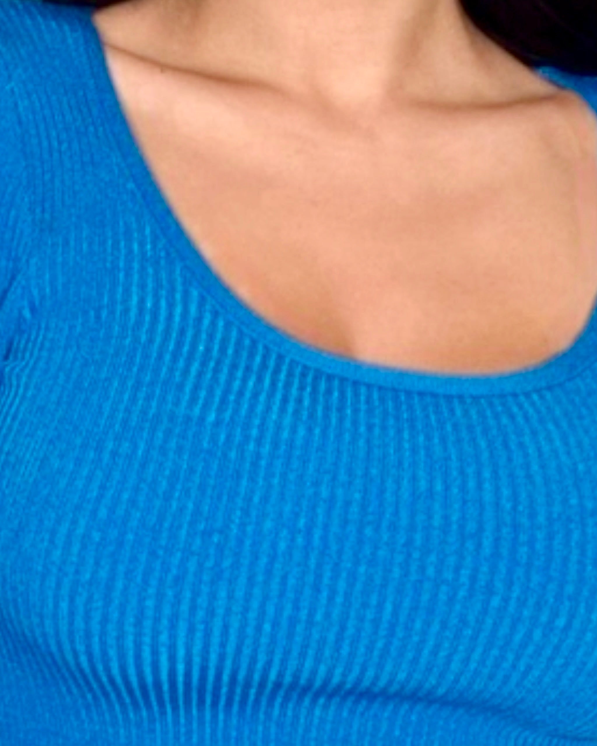 Close up of scoop neck rib knit top in cobalt