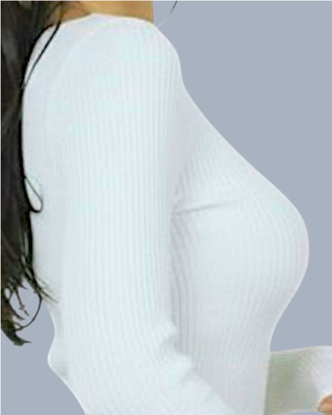 White ribbed scoop neck sweater worn by a person on a gray background