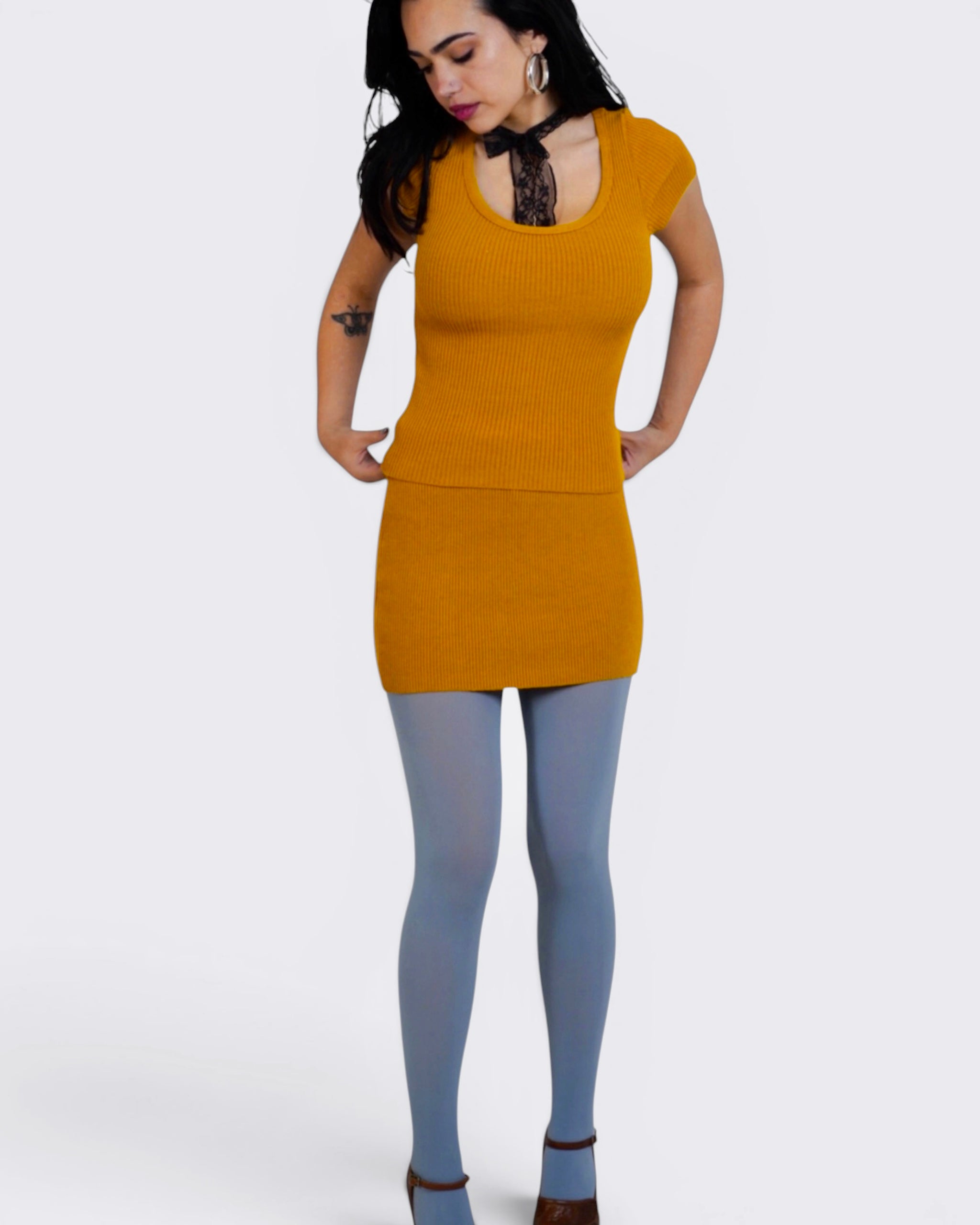 Woman wearing mustard scoop neck short sleeve and mini by TKHLA