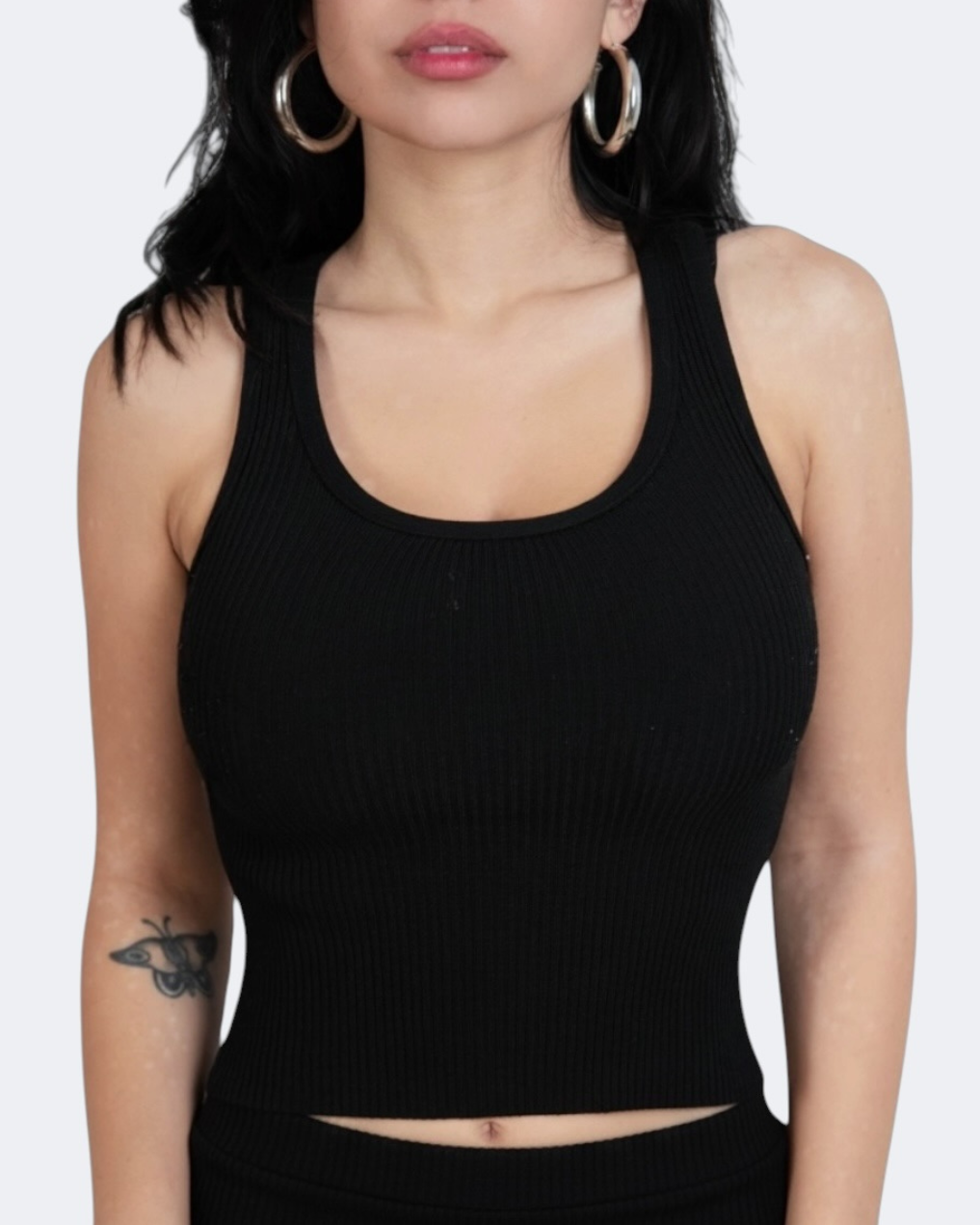 Woman wearing black scoop neck top by The Knit House LA