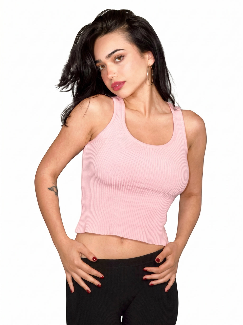 Woman wearing pink rib knit scoop neck tank and black Capri by TKHLA