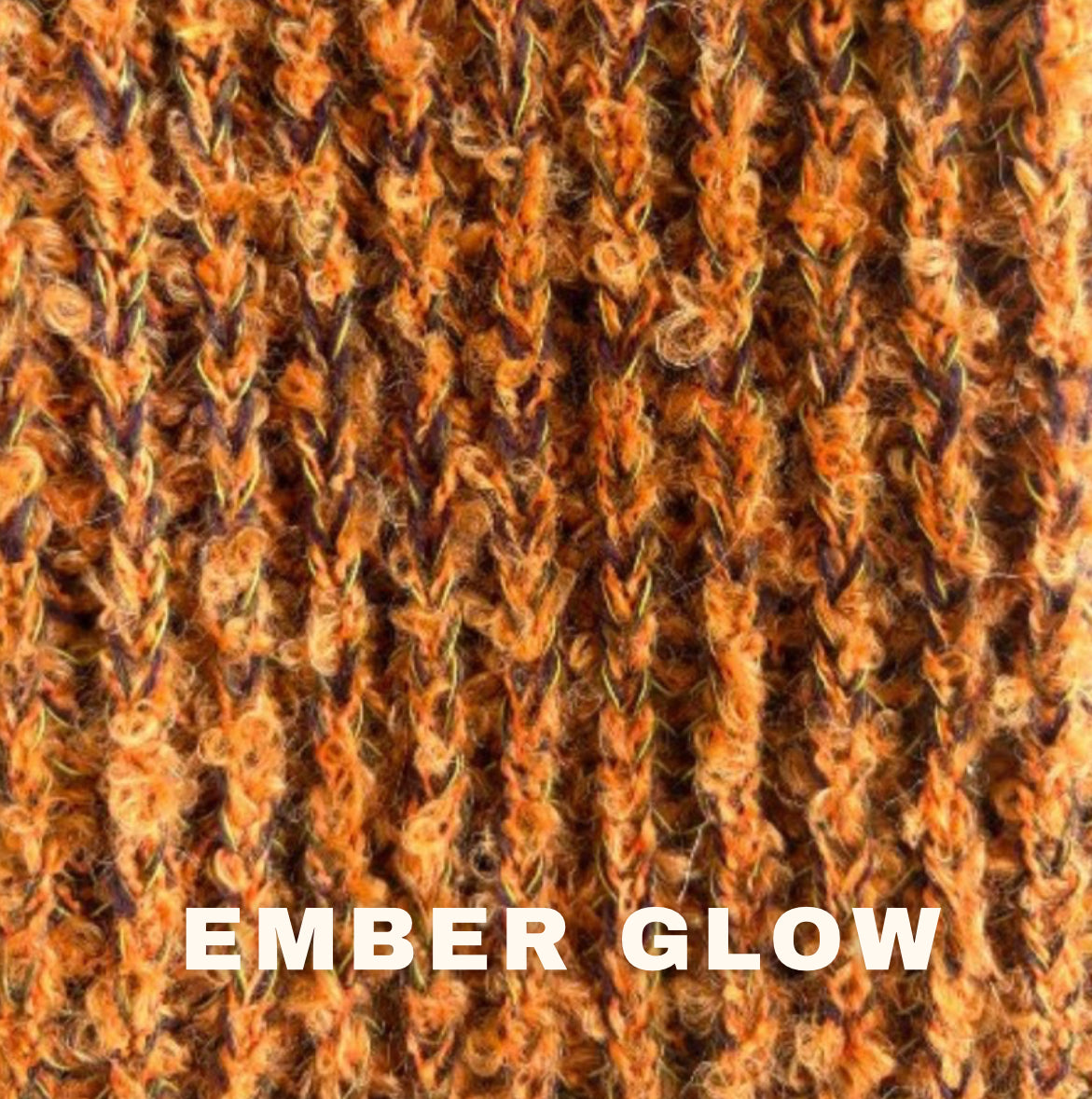 Close-up of textured knit swatch in orange rust with 'Ember Glow' label, by The Knit House LA