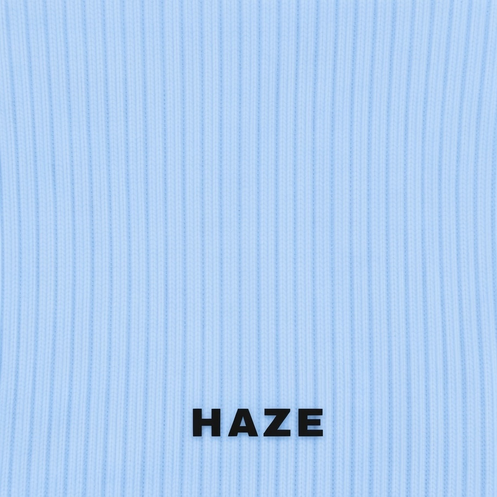 Text 'HAZE' on a blue rib knit textured background