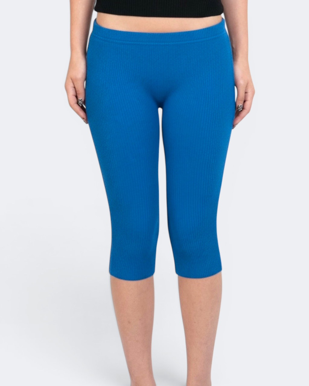 Cobalt Blue capri leggings worn by a person on a white background