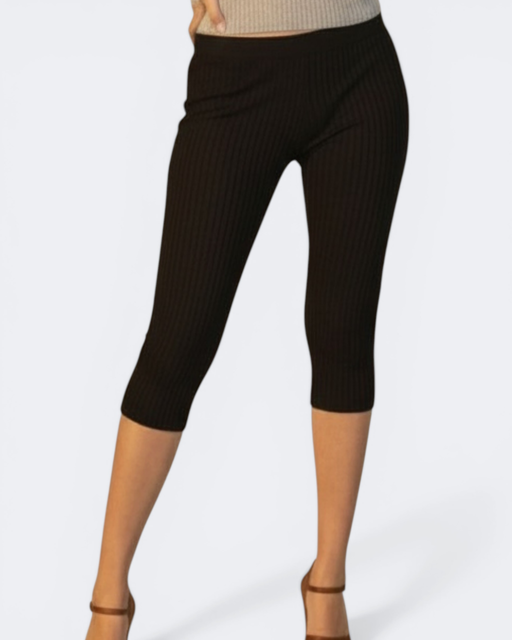 Black ribbed capri leggings worn by a person on a white background
