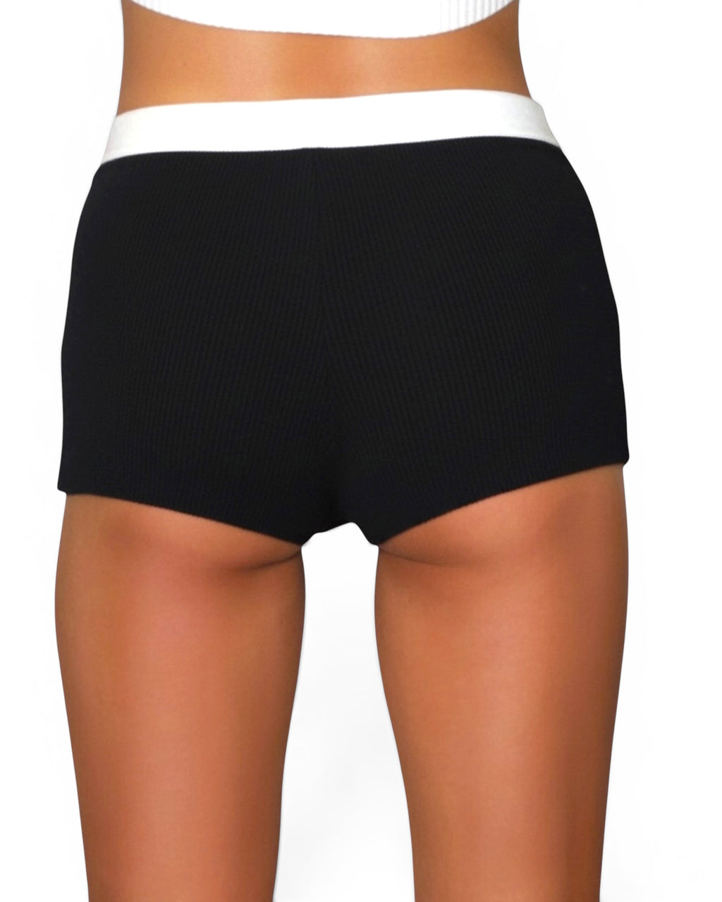 Black shorts with a white waistband on a white background