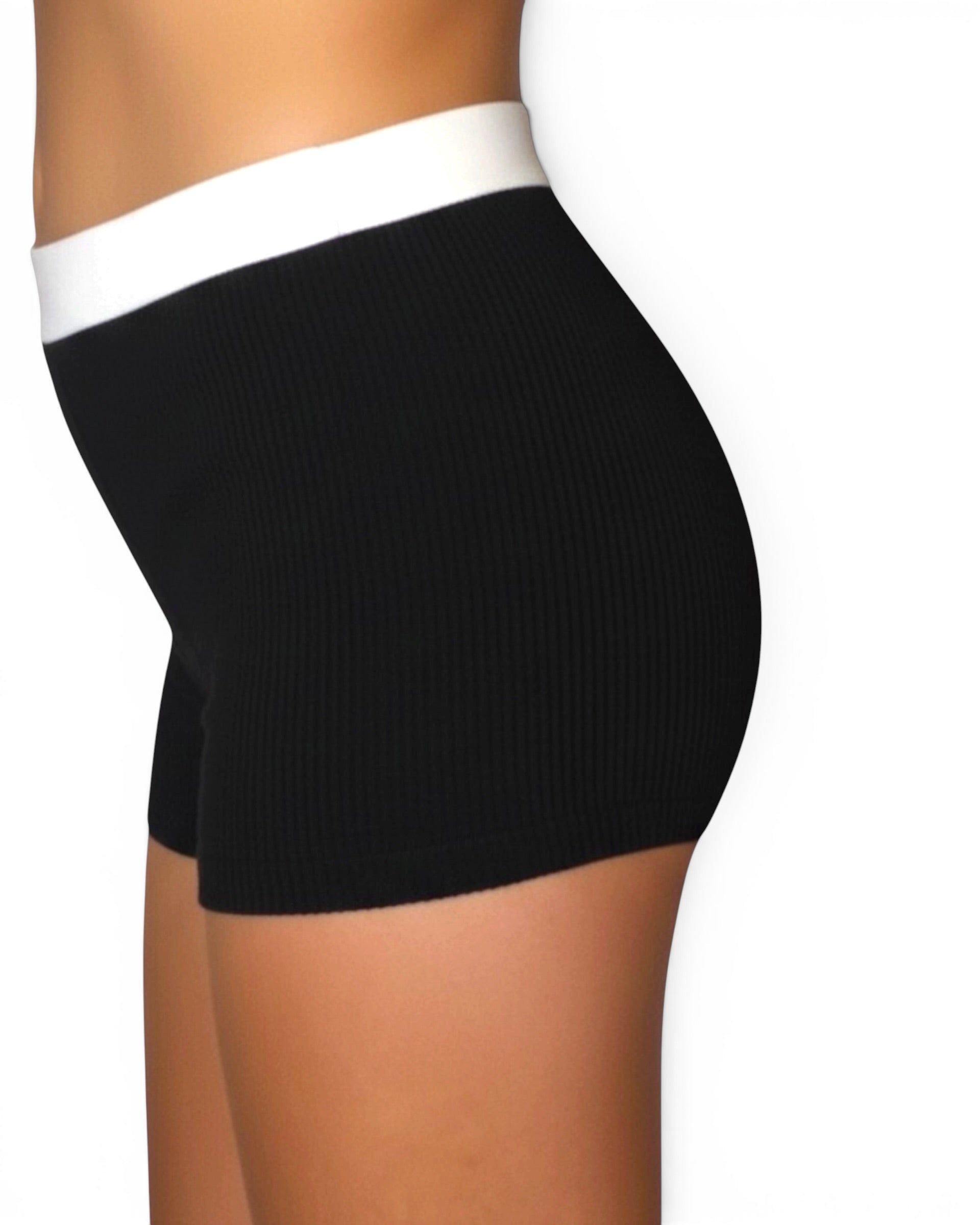 Black high-waisted shorts with white waistband on a white background
