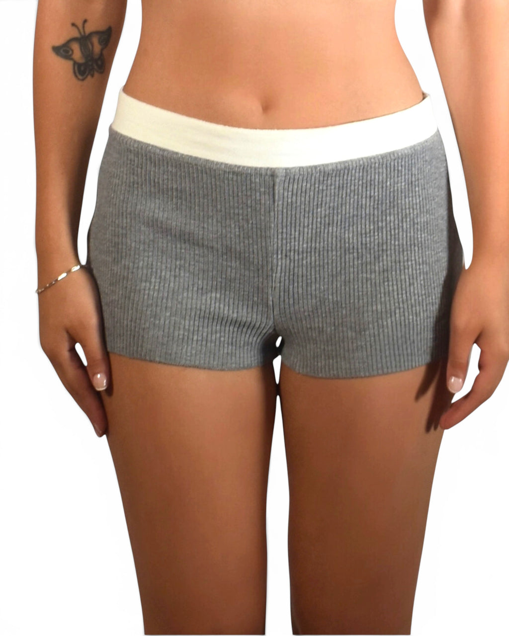 Gray shorts with a white waistband worn by a person on a white background