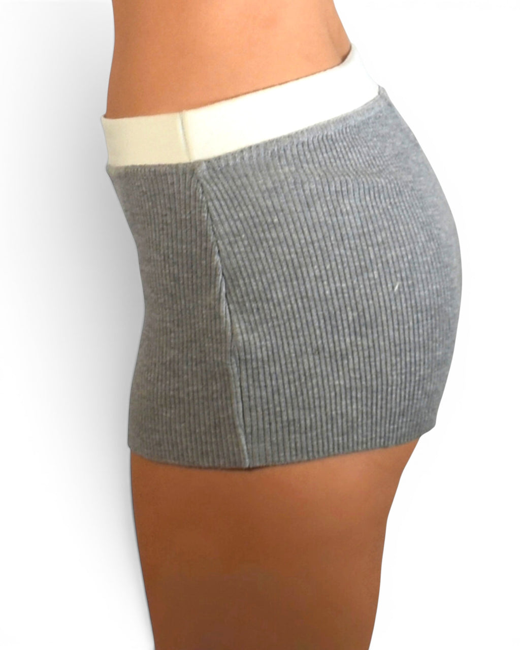 Gray ribbed shorts worn by a person on a white background