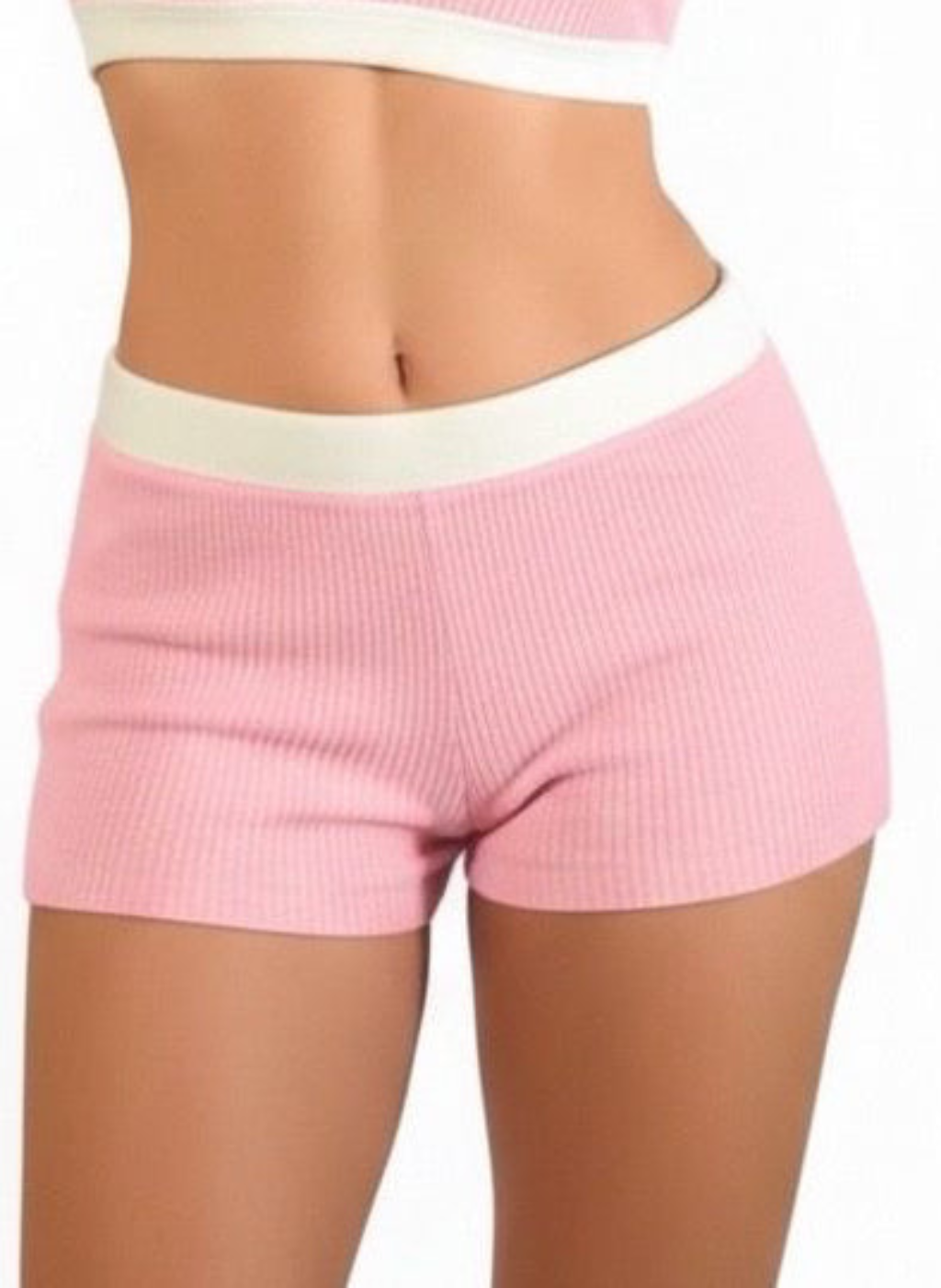 Pink ribbed shorts with a white waistband on a white background