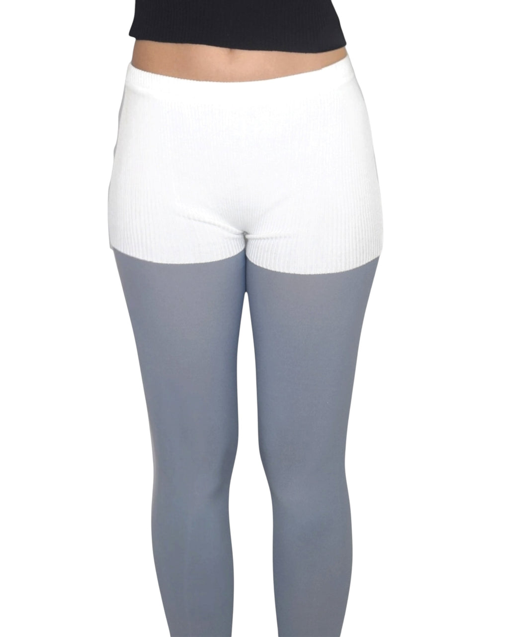 White shorts over gray leggings on a white background