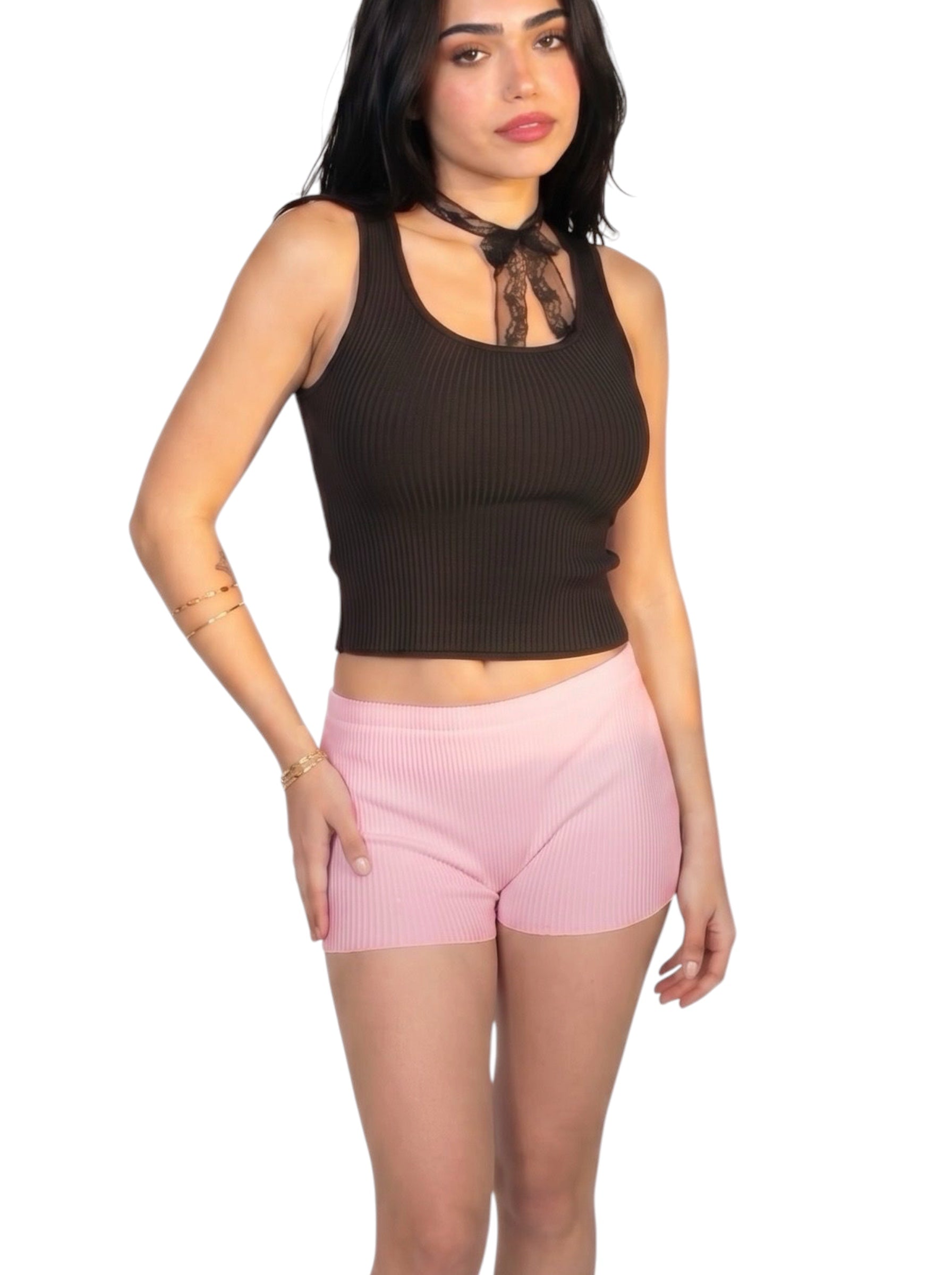 Woman wearing black rib knit scoop neck tank and pink hot pants by TKHLA 