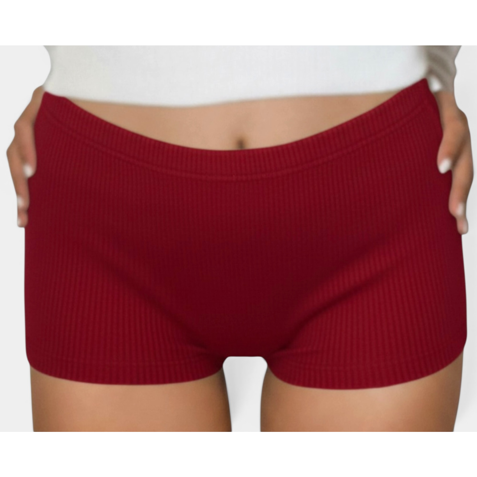 Red ribbed shorts worn by a person on a white background