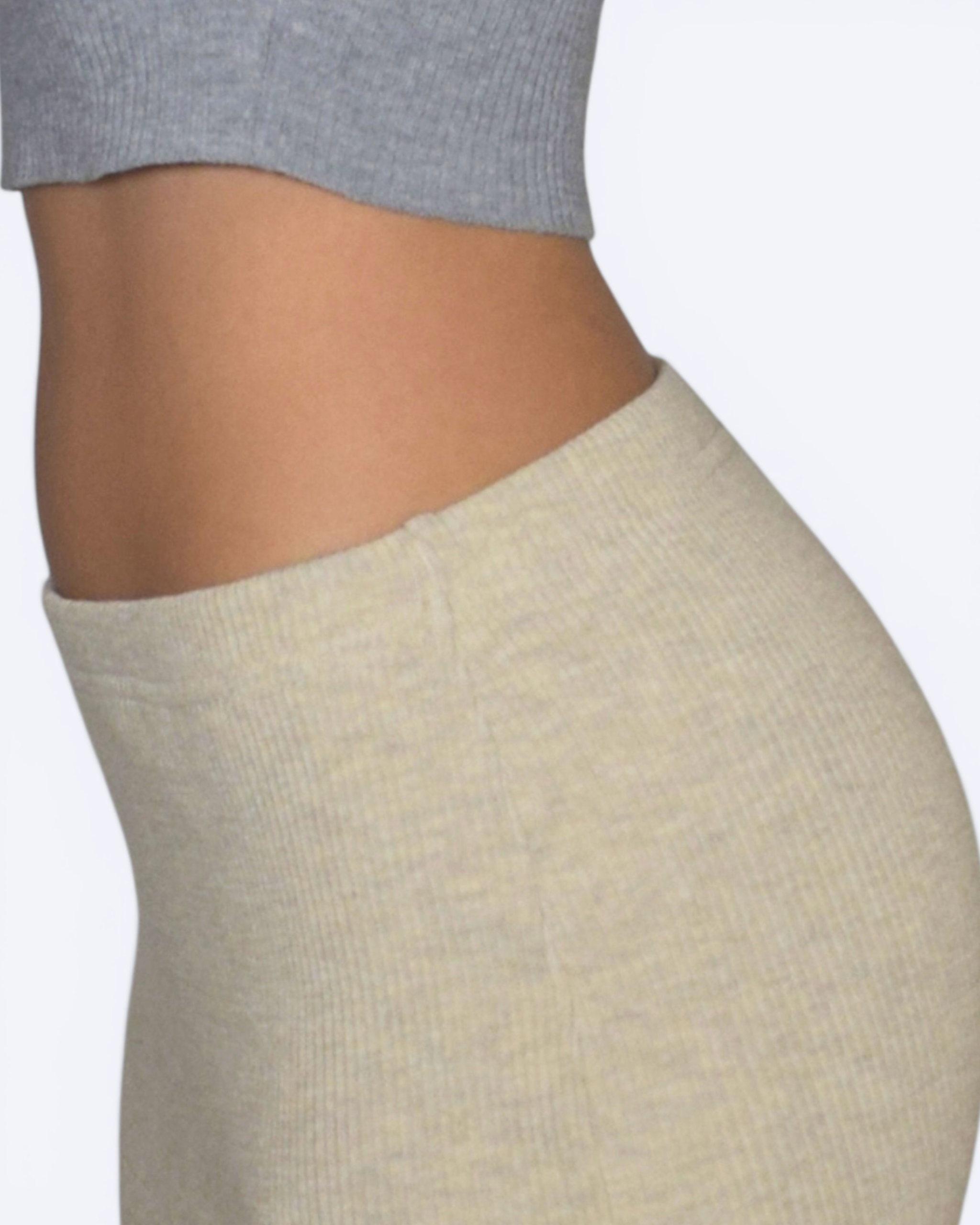 Drift Beige close up of side view skirt waistband worn by a person on a white background