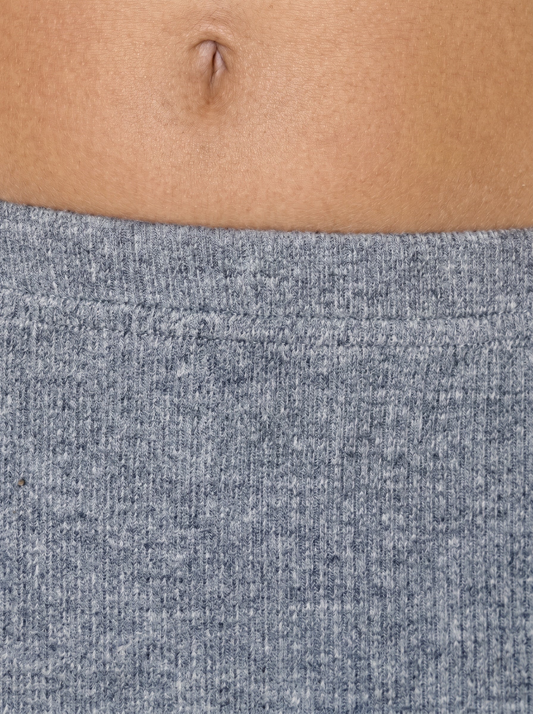 Close up of waistline of mist grey rib knit by TKHLA 