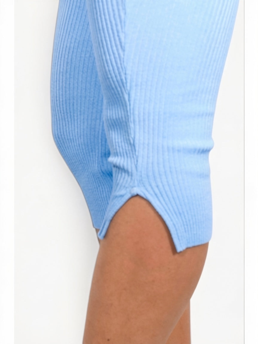 Light blue ribbed sweater sleeve on a white background