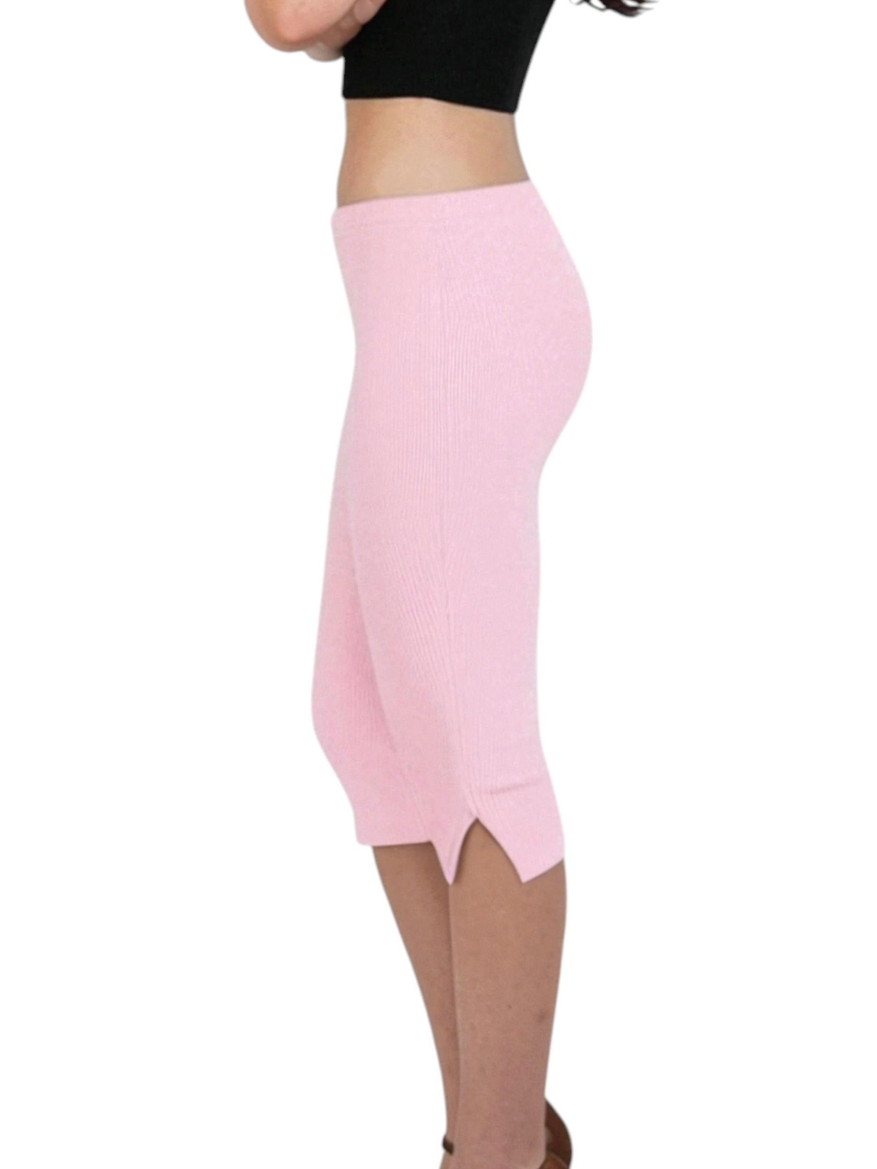 Pink knee-length skirt worn by a person on a white background