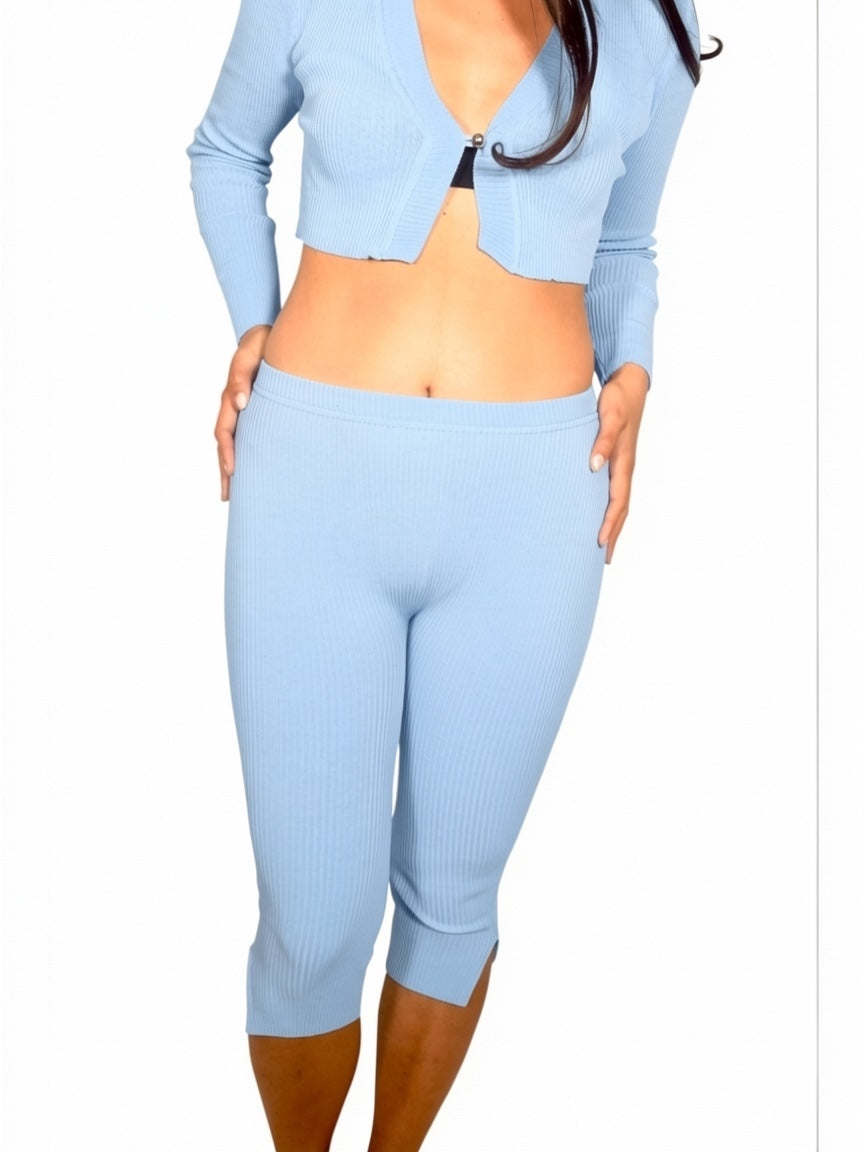 Light blue ribbed crop top and capri leggings on a white background