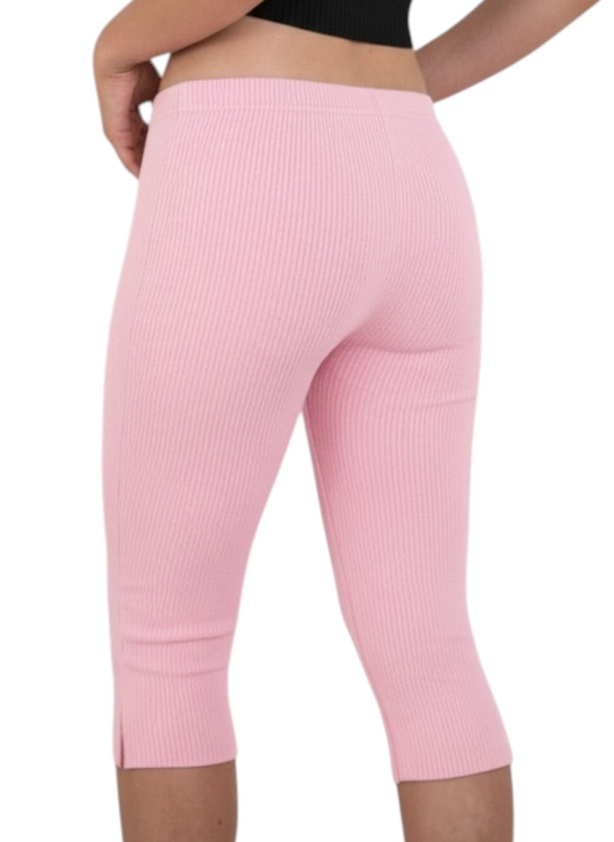 Pink ribbed leggings worn by a person on a white background