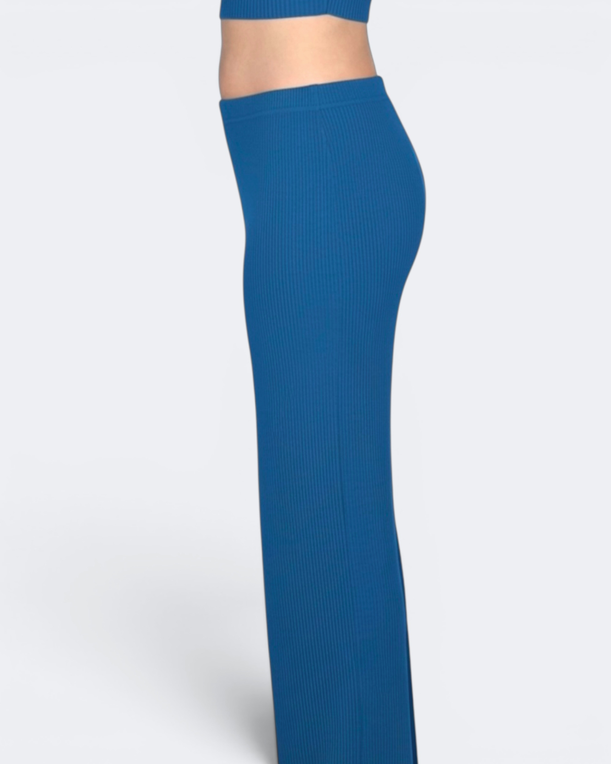 Woman wearing blue long skirt by The Knit House LA