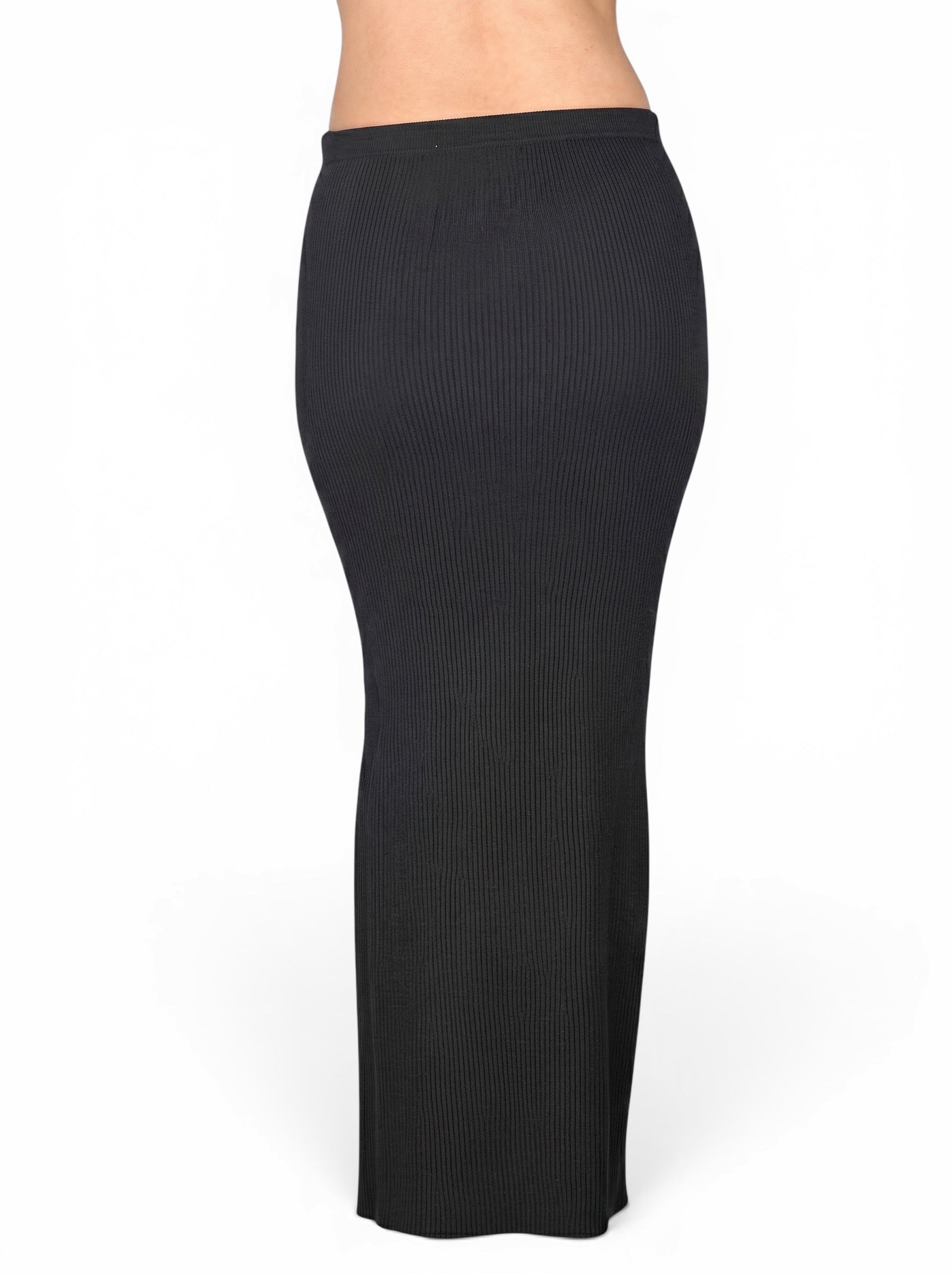 Back view of black rib knit long straight skirt by TKHLA 