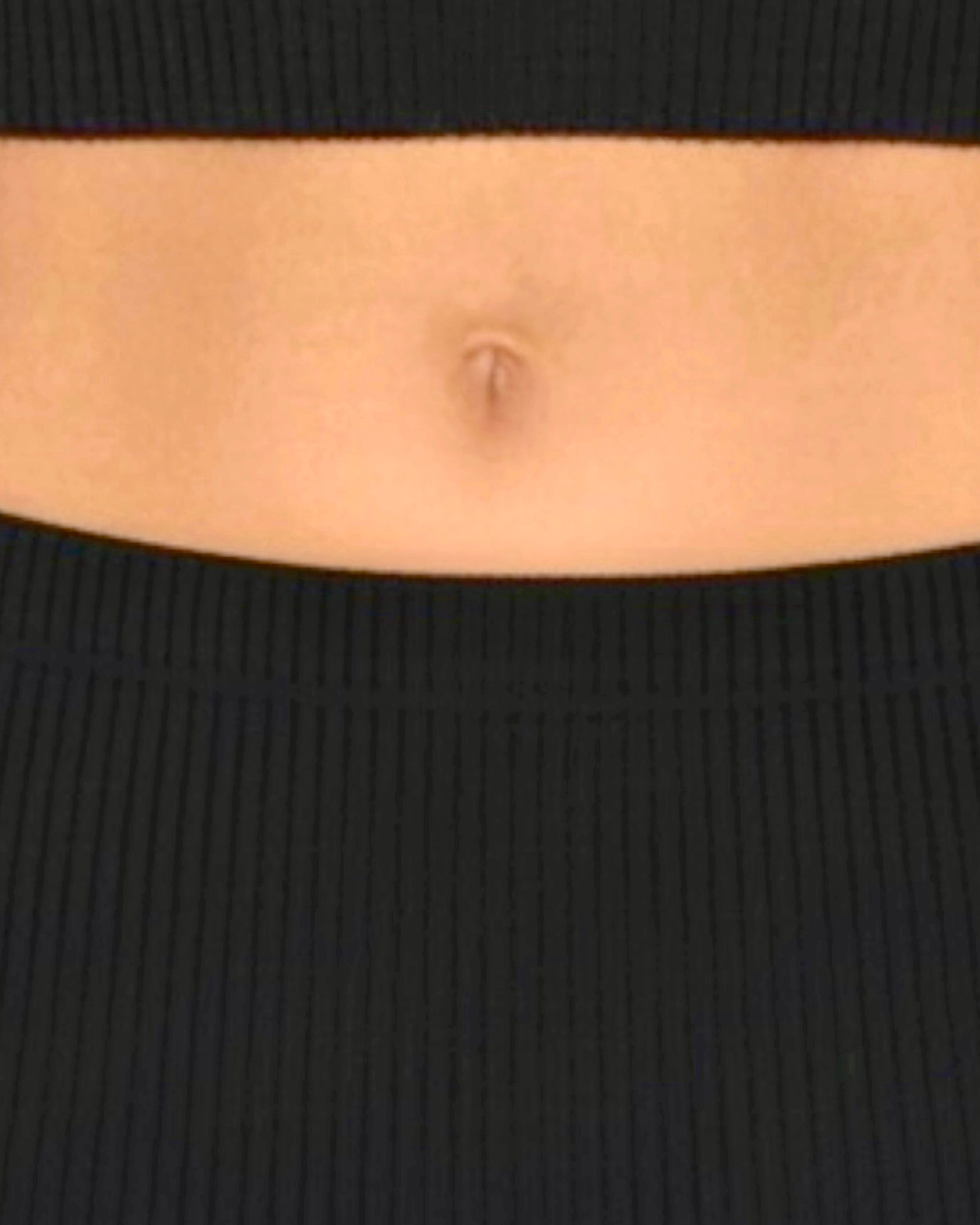 Close up of black rib knit skirt waistband 