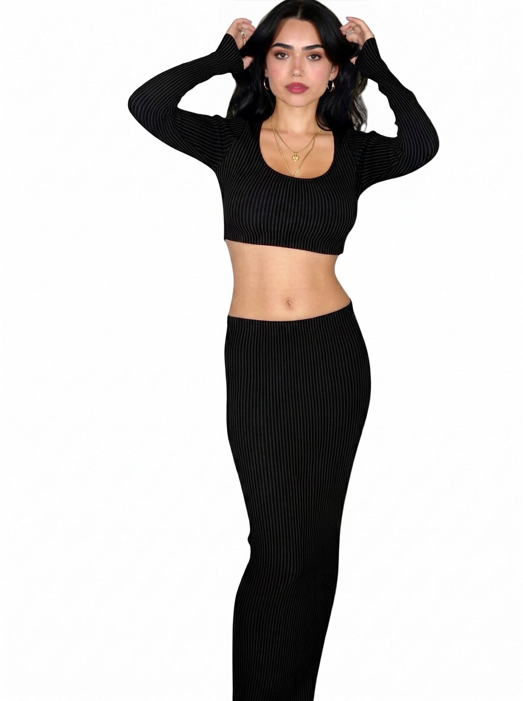Woman wearing matching black rib knit long sleeve crop top and long straight skirt by TKHLA 