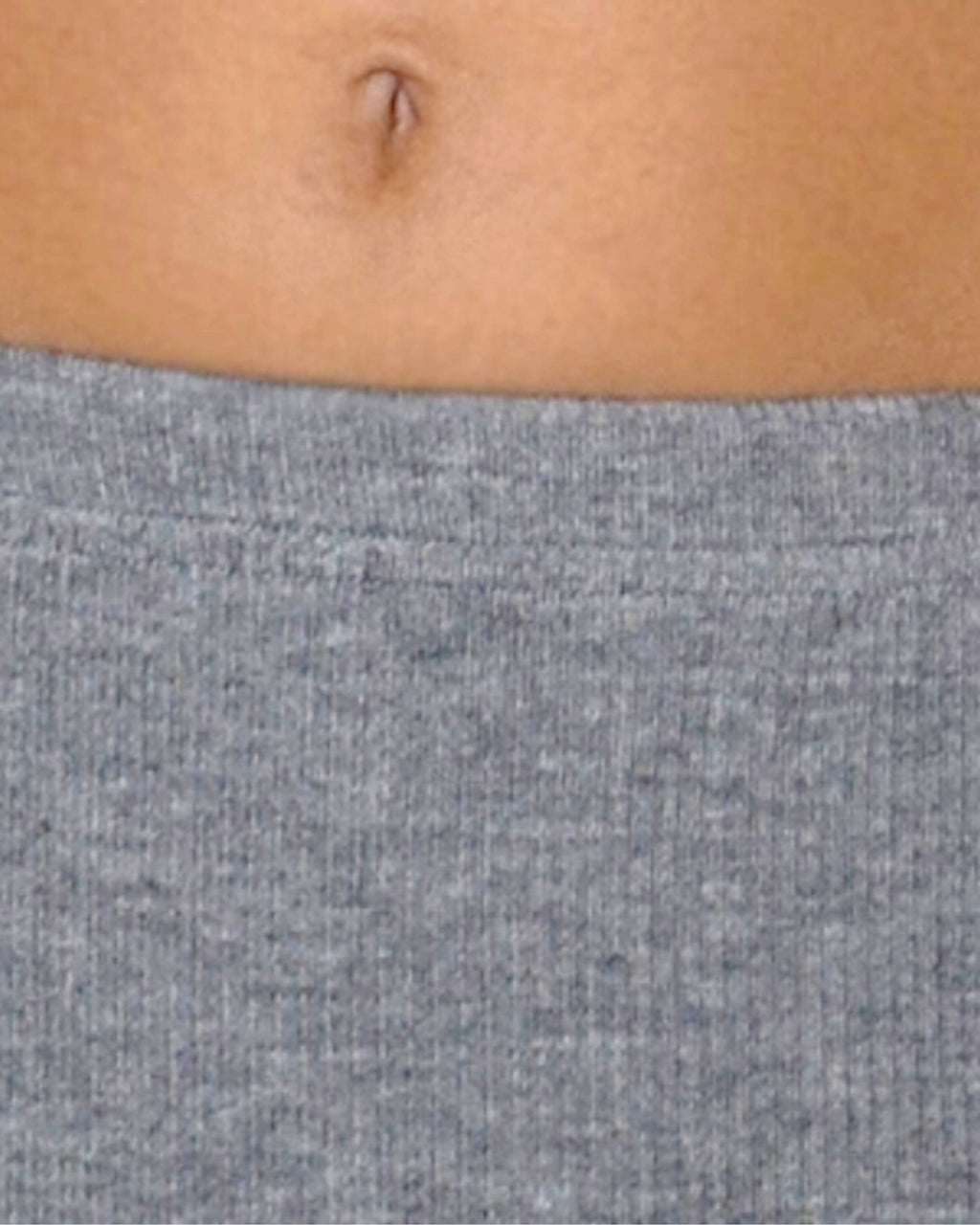 Gray textured fabric covering a person's midsection
