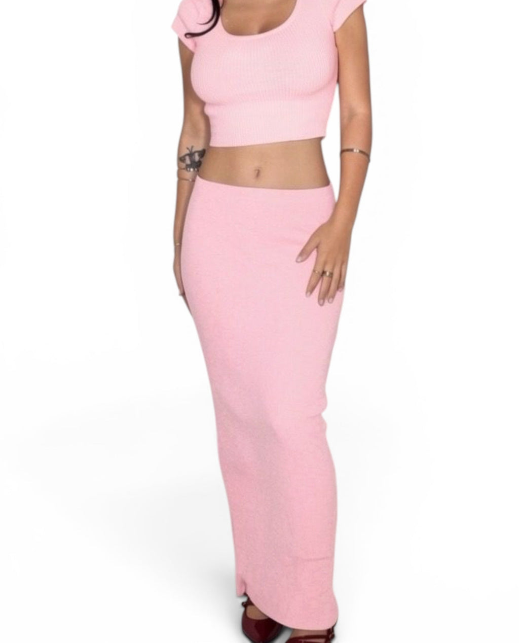Woman wearing a pink outfit on a white background