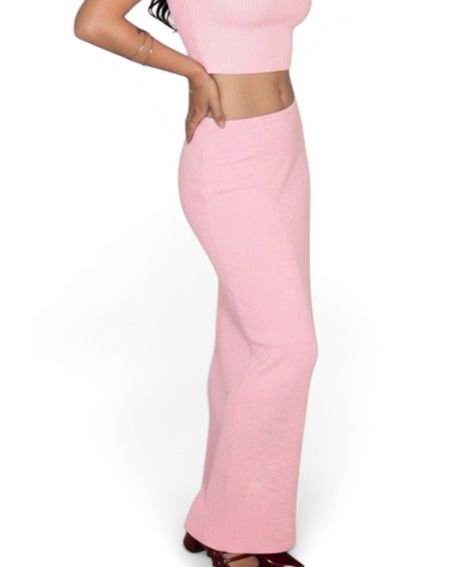 Woman wearing a pink outfit on a white background