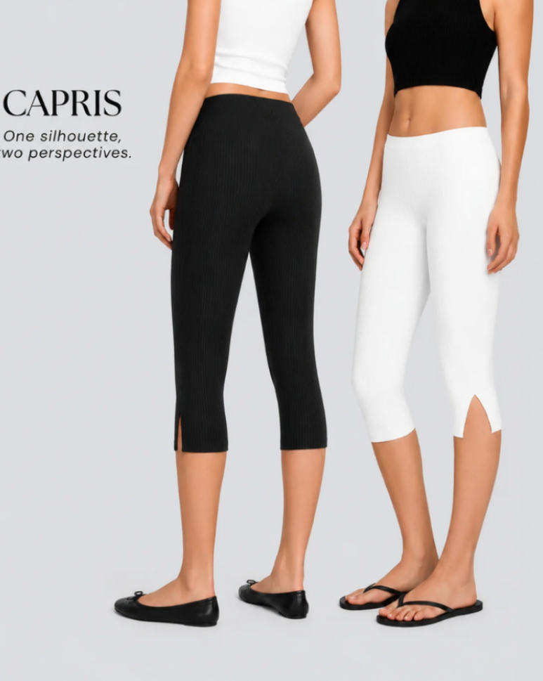 Two models wearing CAPRIS ribbed capri leggings shown from the back on a light gray background. One model wears black capris with a white crop top, and the other wears white capris with a black crop top.