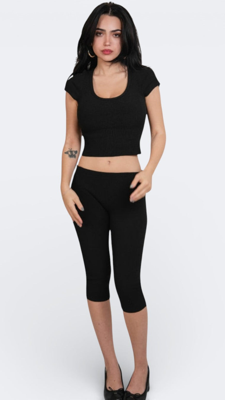 woman wearing fitted rib knit capri with matching scoop neck top in Ink black by The Knit House LA.
