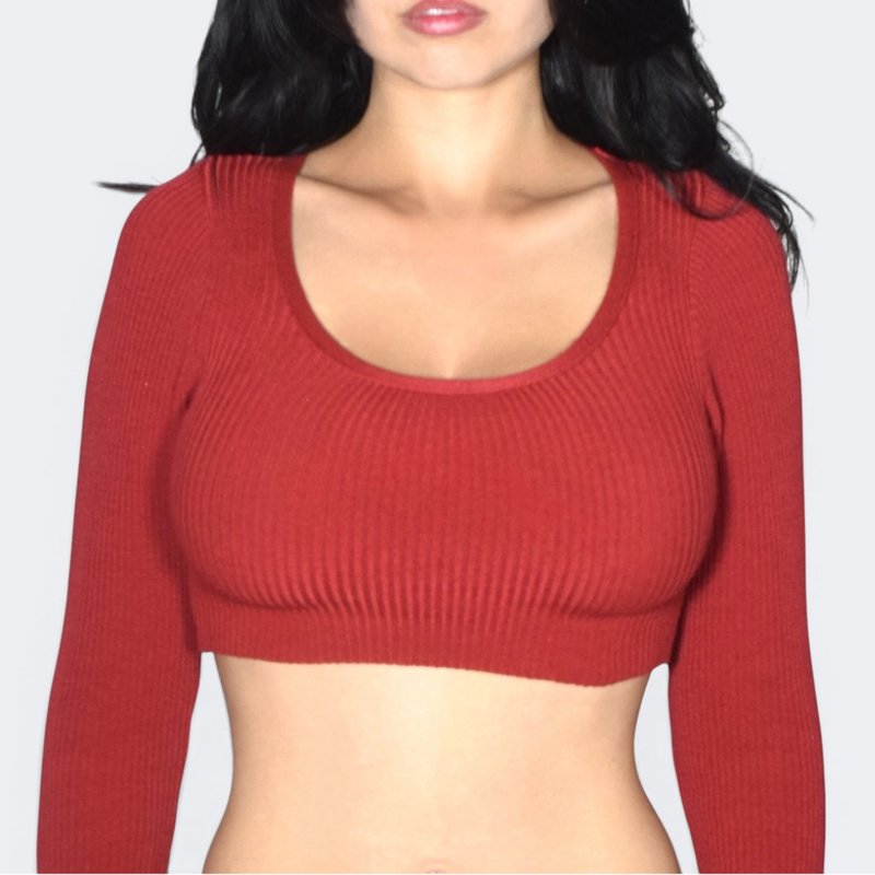 Red ribbed long-sleeve crop top worn by a person on a white background