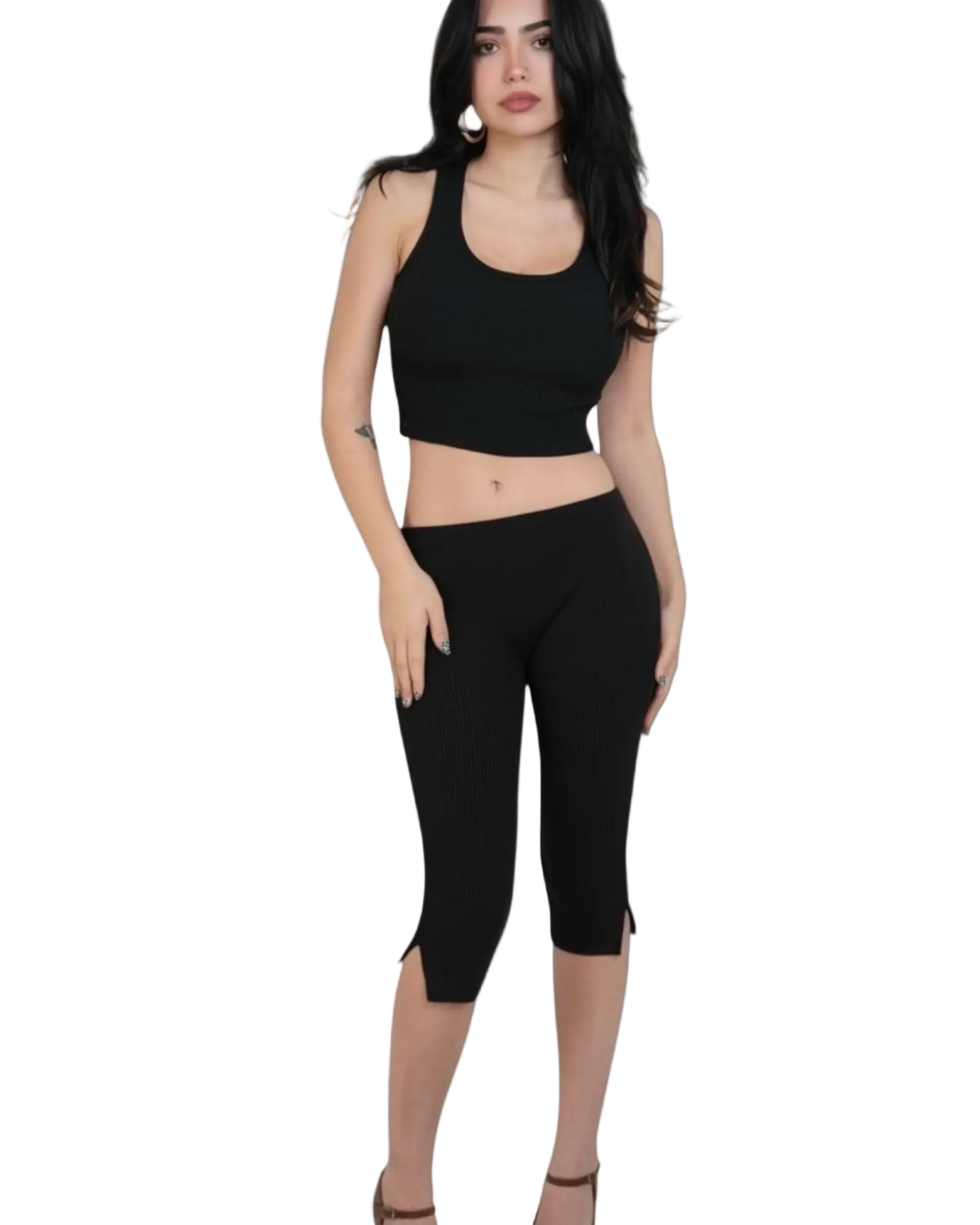 Woman wearing a black crop scoop-neck top and capri leggings on a light gray background