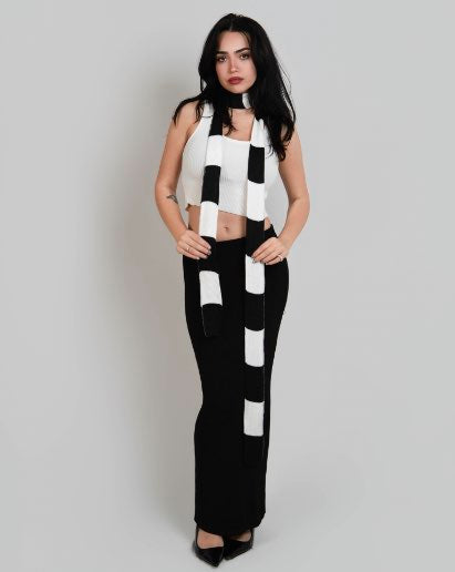 Woman wearing an extra long skinny stripe knit scarf in Porcelain white and Coal black stripes by The Knit House LA