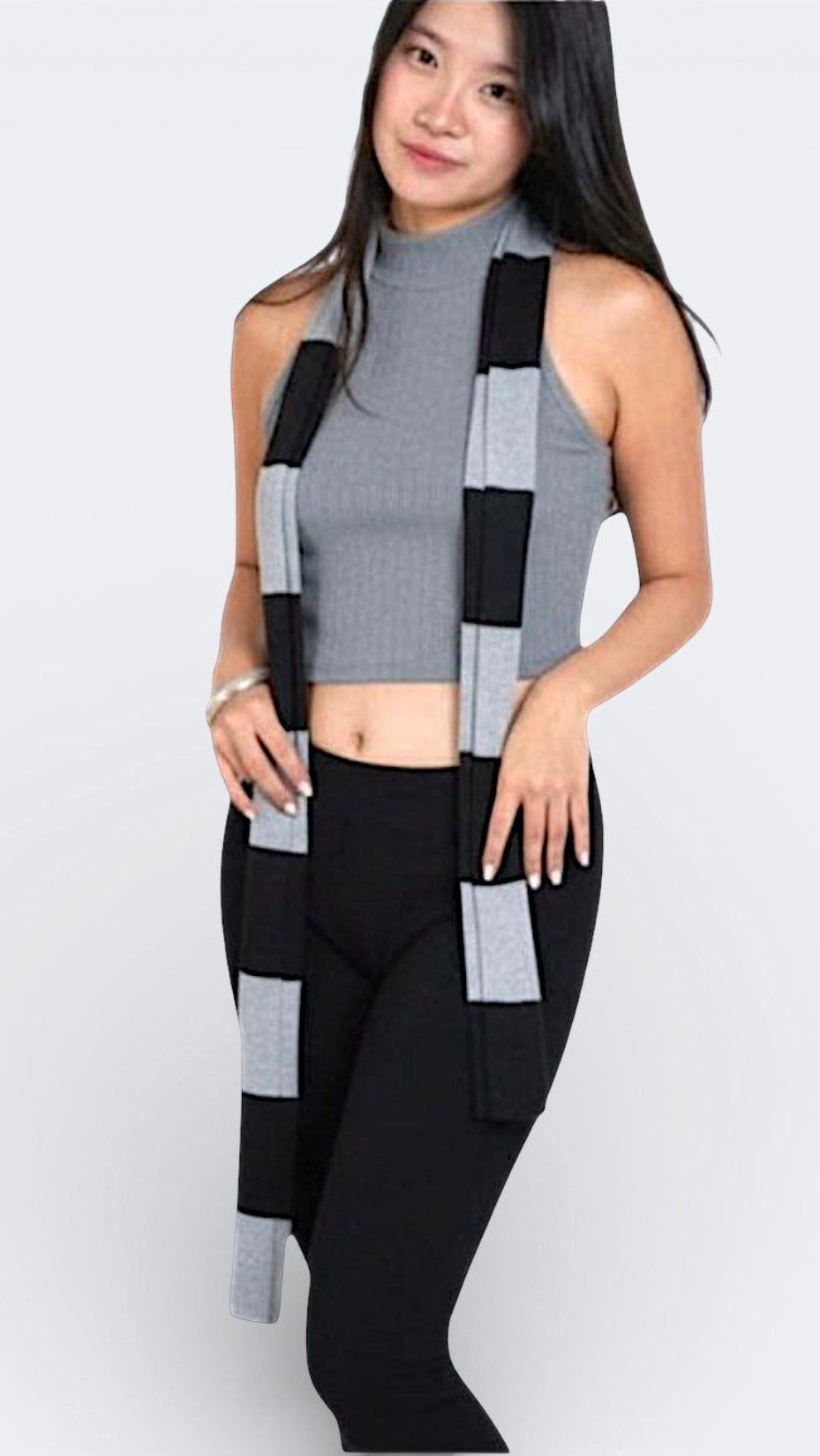 woman wearing a sleeveless fitted rib crop shell with high neck in Mist grey by The Knit House La.