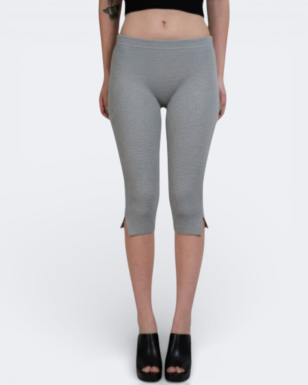 Person wearing Mist gray fitted knit capri leggings with side slits by The Knit House LA  on a white background
