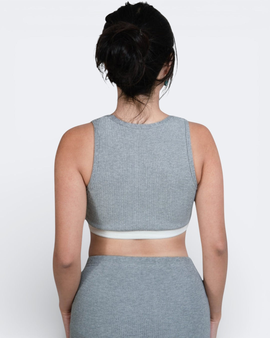 woman wearing fitted rib knit crop tank with scoop neckline and white band with matching long skirt in Mist grey by The Knit House LA.