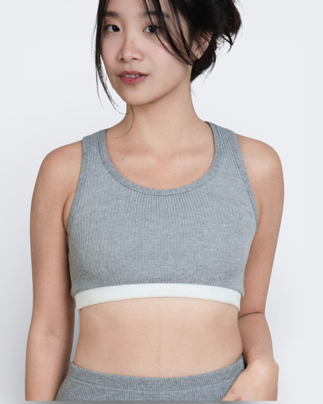 woman wearing fitted rib knit crop tank with scoop neckline and white band with matching long skirt in Mist grey by The Knit House LA.