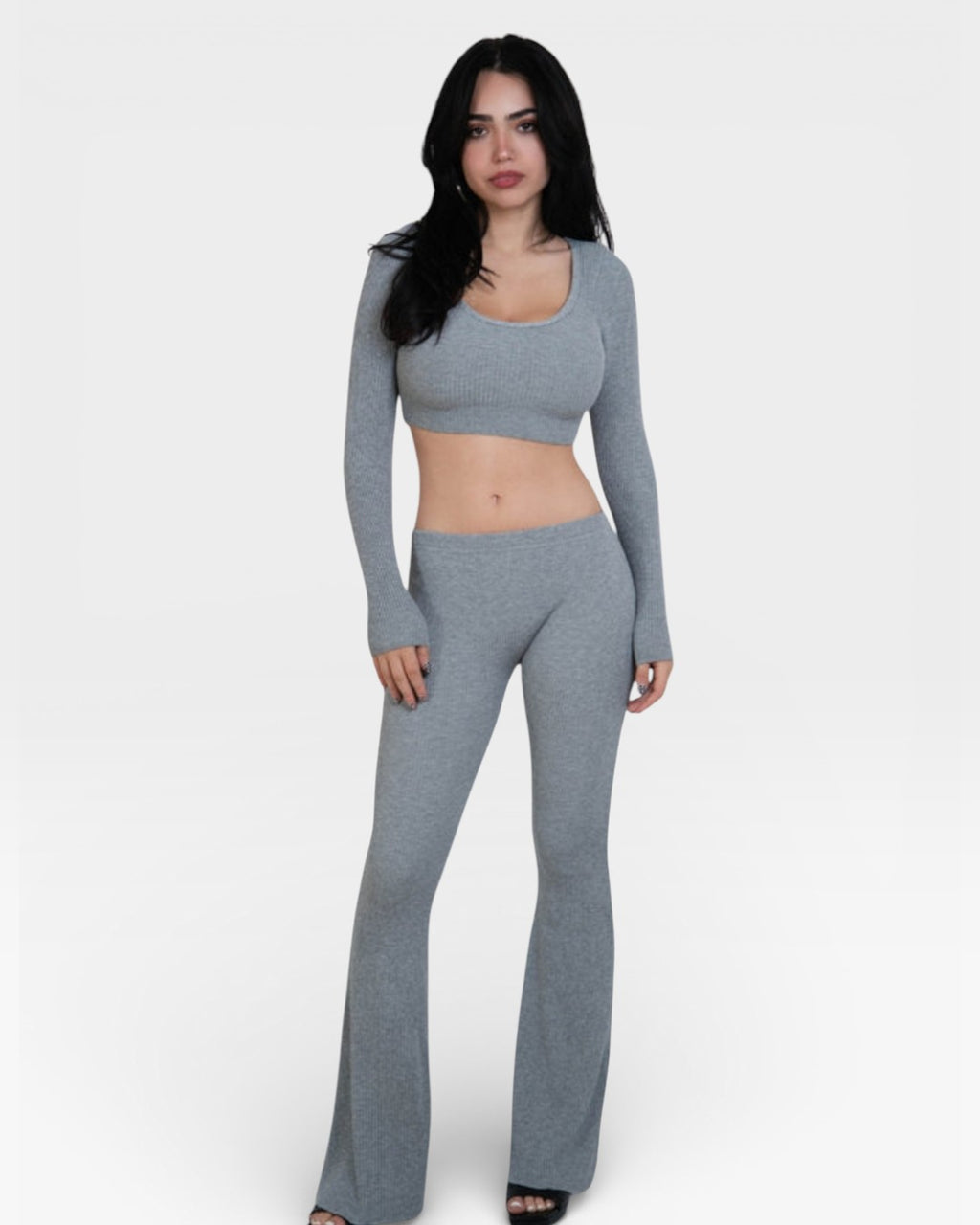 woman wearing fitted rib knit flared leg pant and crop top in Mist grey by The Knit House LA.
